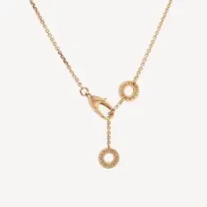 Second-hand jewellery: Diva's Dream necklace with fan-shaped motif in pink gold and turquoise topped with a small diamond