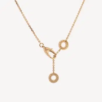 Second-hand jewellery: Diva's Dream necklace with fan-shaped motif in pink gold and turquoise topped with a small diamond