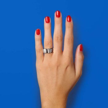 hand on blue background with second-hand Montblanc ring